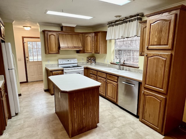 kitchen with a sink, white appliances, custom exhaust hood, and light floors