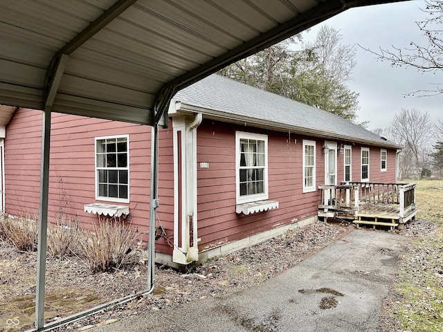 view of side of home featuring a wooden deck