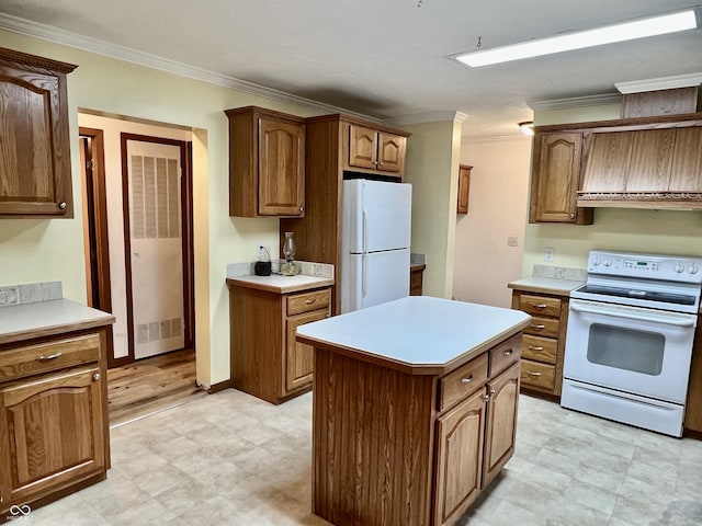 kitchen featuring white appliances, custom exhaust hood, ornamental molding, and a center island