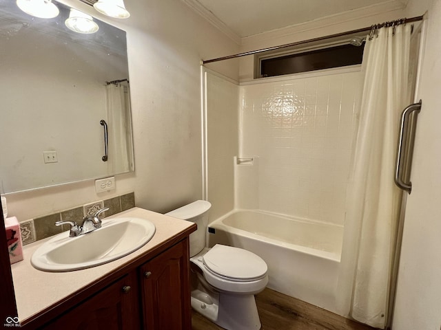 full bath featuring toilet, ornamental molding, wood finished floors, shower / tub combo, and vanity