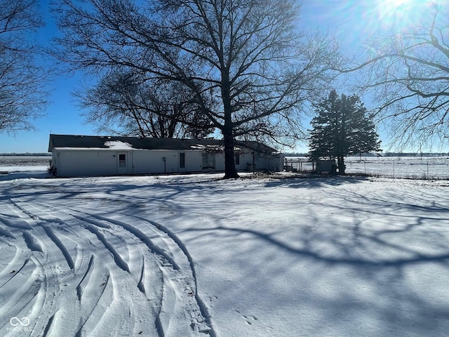 view of yard layered in snow