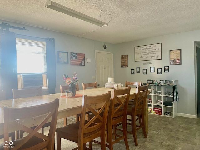 dining area with a textured ceiling