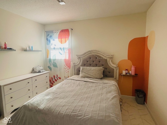 bedroom with a textured ceiling