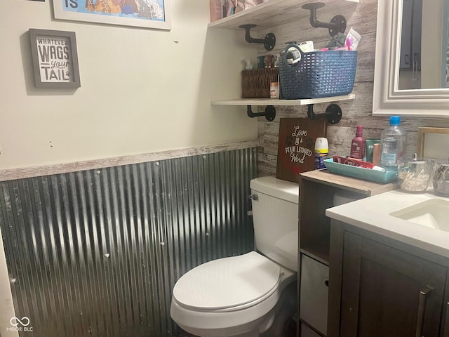 bathroom featuring toilet and vanity