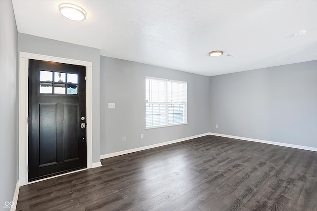 entryway with dark hardwood / wood-style flooring