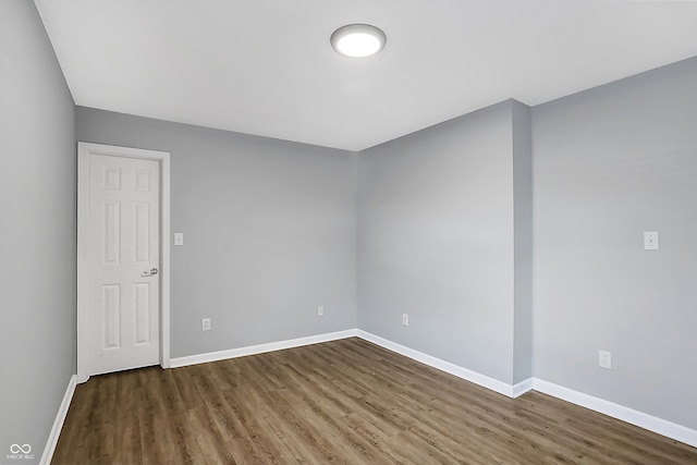 spare room with hardwood / wood-style floors