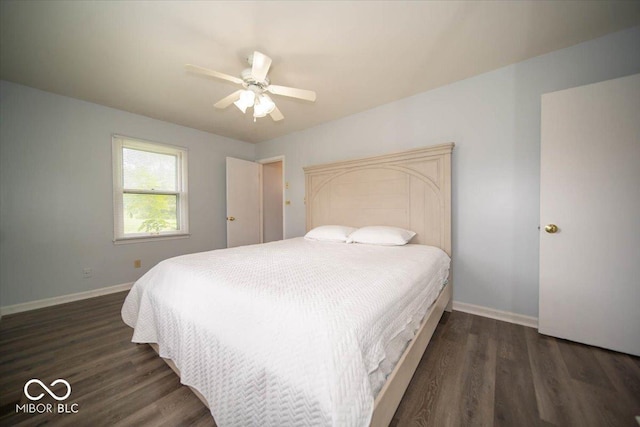 bedroom with ceiling fan and dark hardwood / wood-style flooring