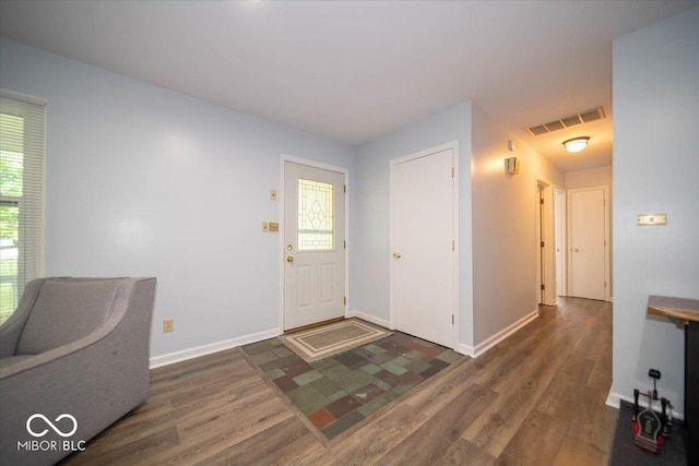 entrance foyer with dark hardwood / wood-style flooring