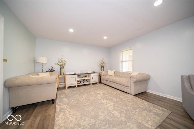 living room with dark hardwood / wood-style flooring