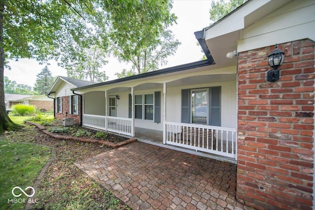 doorway to property featuring covered porch