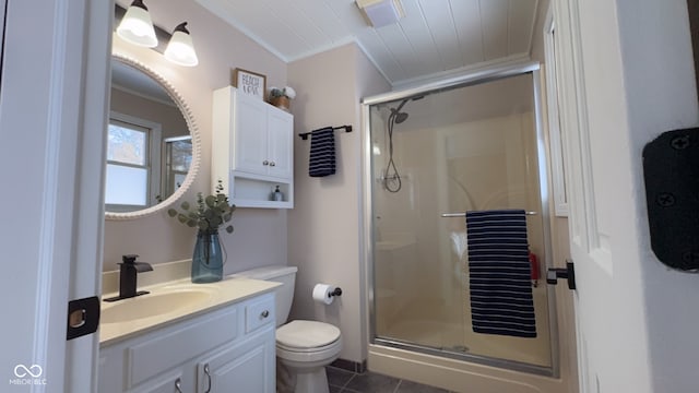 bathroom with vanity, tile patterned flooring, crown molding, and a shower with door