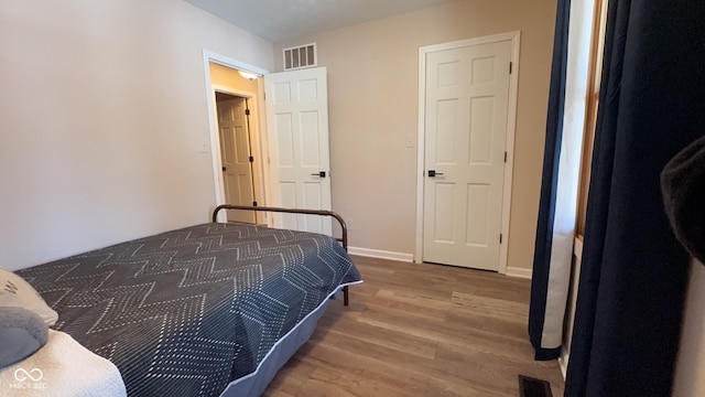 bedroom featuring hardwood / wood-style flooring