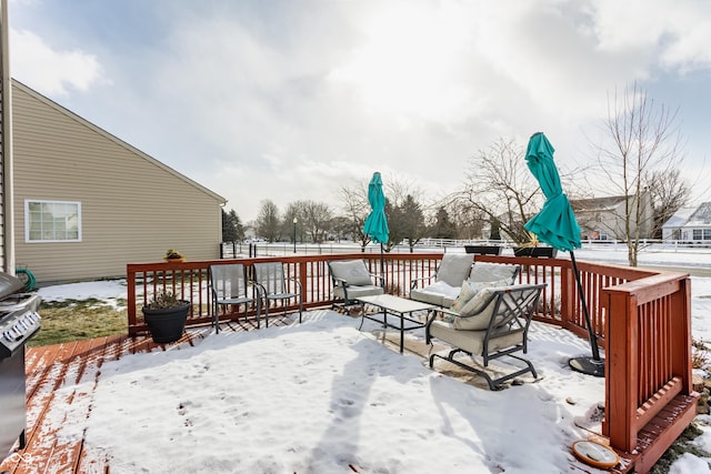 view of snow covered deck