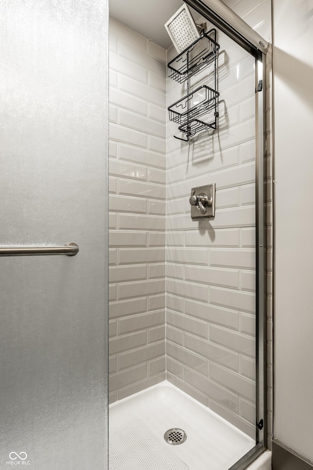 bathroom with a shower with shower door