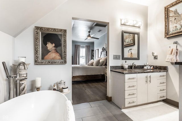 full bath with vanity, a freestanding tub, ceiling fan, tile patterned flooring, and ensuite bathroom