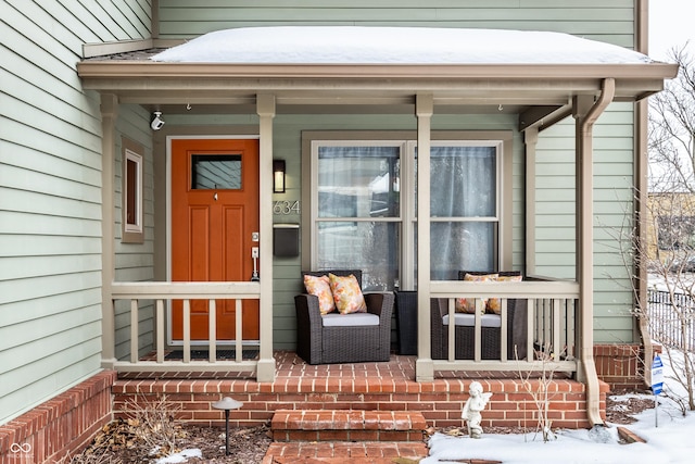 view of snow covered property entrance