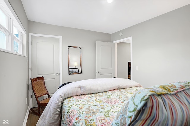 bedroom with hardwood / wood-style flooring