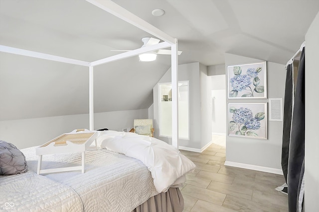 bedroom featuring ceiling fan and vaulted ceiling