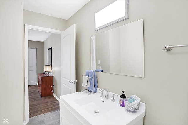 bathroom with wood-type flooring and vanity