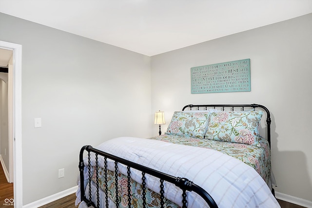 bedroom featuring dark hardwood / wood-style flooring