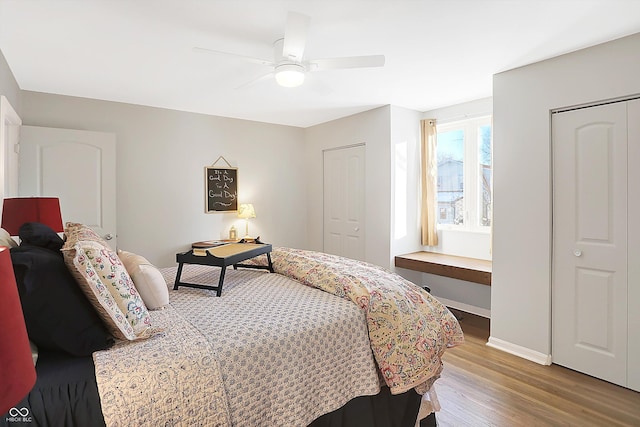 bedroom with ceiling fan and wood-type flooring