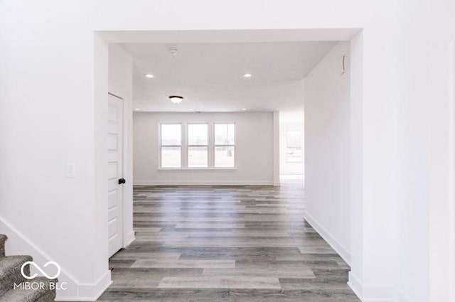 hall with wood-type flooring