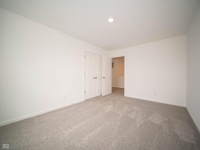7824 Magnolia St, New Palestine, IN 46163 - carpeted empty room featuring baseboards and recessed lighting