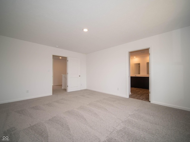 7824 Magnolia St, New Palestine, IN 46163 - unfurnished bedroom featuring light carpet, recessed lighting, and ensuite bathroom