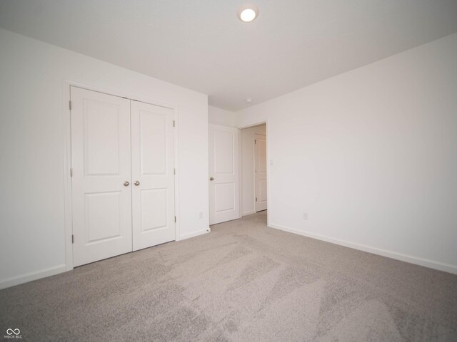 7824 Magnolia St, New Palestine, IN 46163 - unfurnished bedroom featuring carpet floors and a closet