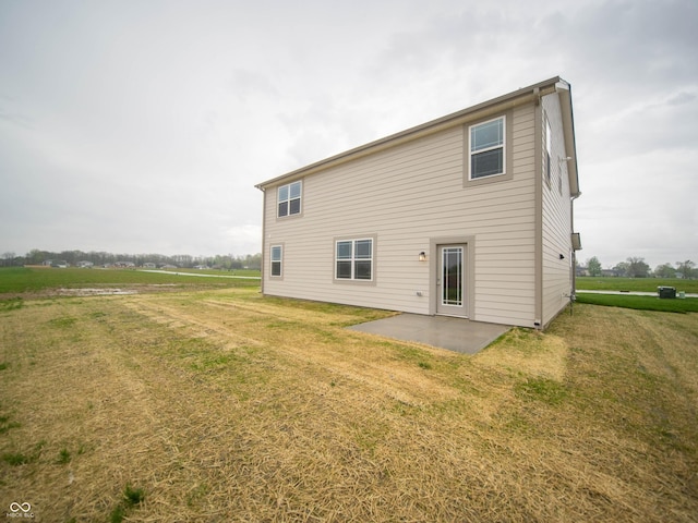 7824 Magnolia St, New Palestine, IN 46163 - back of house featuring a patio and a lawn