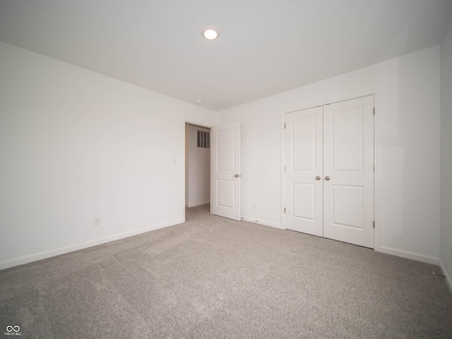 7824 Magnolia St, New Palestine, IN 46163 - unfurnished bedroom with carpet floors, a closet, and recessed lighting