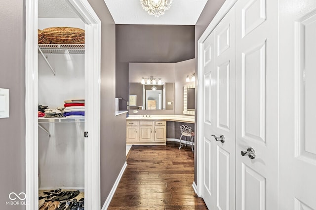 bathroom featuring vanity, hardwood / wood-style flooring, and a textured ceiling