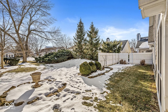 view of yard covered in snow