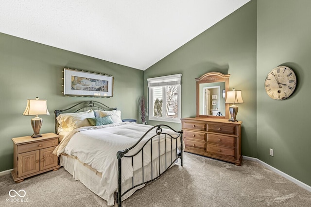 carpeted bedroom featuring lofted ceiling