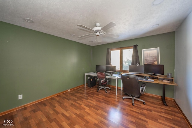 office with ceiling fan, wood-type flooring, and a textured ceiling