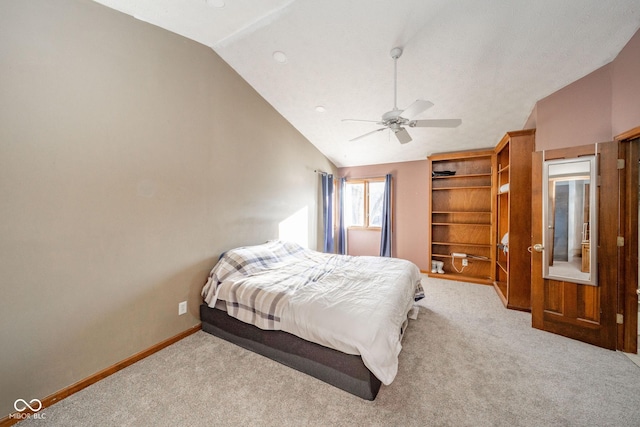 carpeted bedroom with vaulted ceiling and ceiling fan