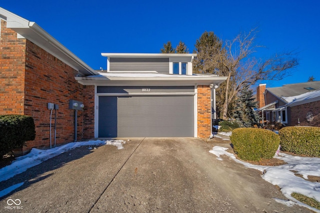 view of side of home with a garage