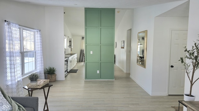 corridor featuring light wood-type flooring