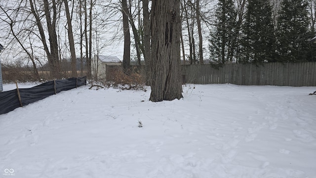 view of yard covered in snow