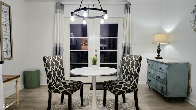 dining space featuring wood-type flooring