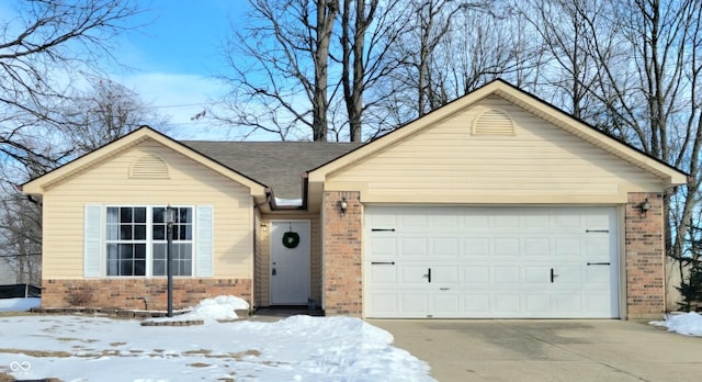 ranch-style home featuring a garage