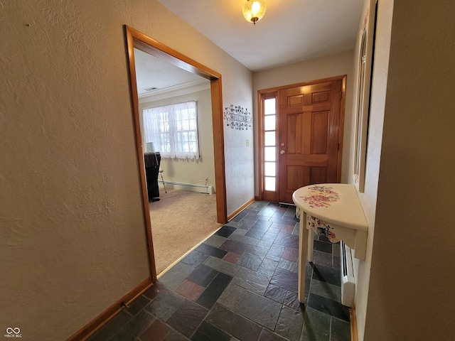 foyer entrance featuring baseboard heating