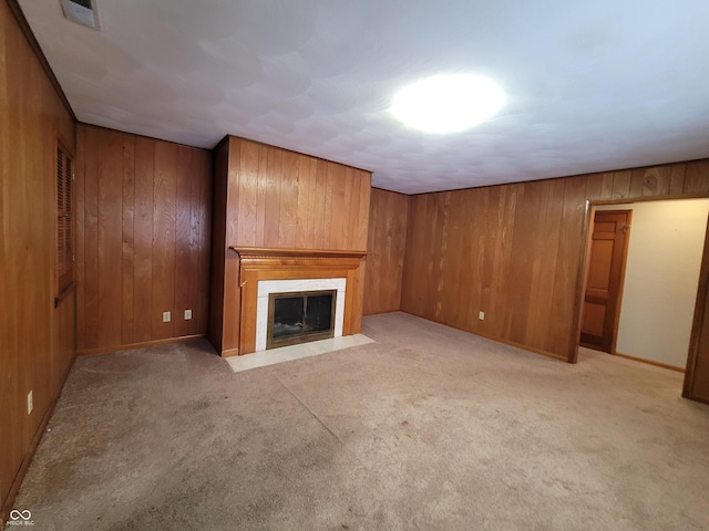 unfurnished living room featuring light carpet