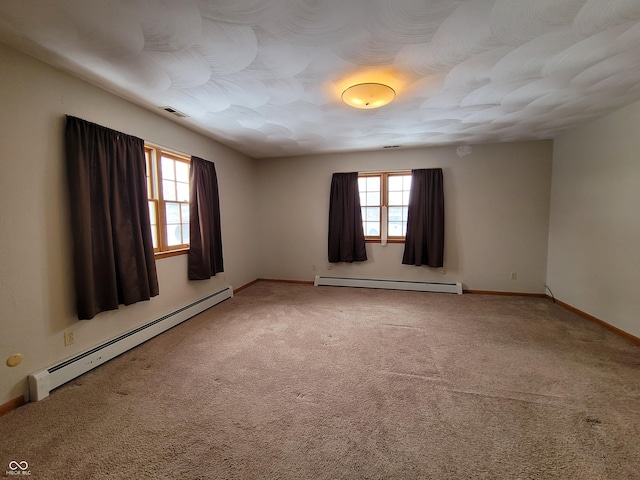 unfurnished room with carpet flooring and a baseboard radiator