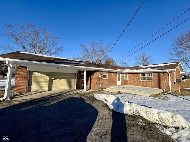 view of front facade featuring a garage and a carport