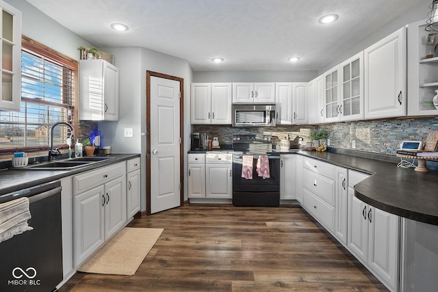 kitchen featuring white cabinetry, black range with electric cooktop, sink, dishwashing machine, and dark wood-type flooring