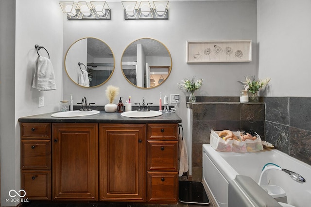 bathroom with a tub and vanity