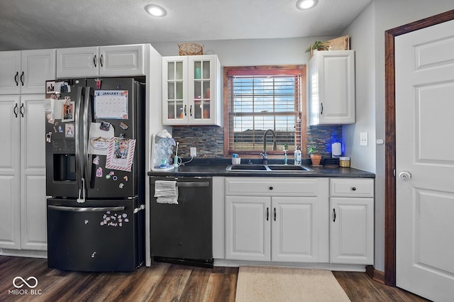 kitchen with sink, backsplash, white cabinets, and stainless steel appliances