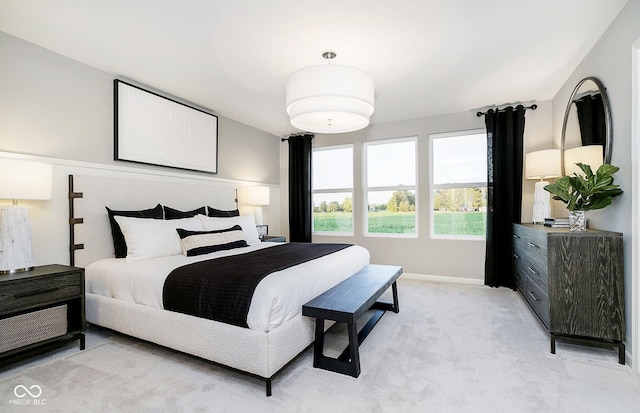 bedroom with light colored carpet