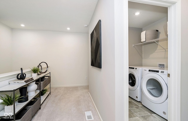 washroom with washer and dryer